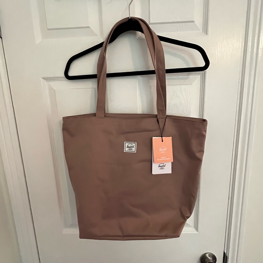 Cute maybe/blush tote by Herschel supply company.
